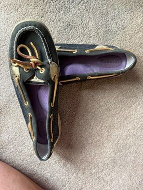 Sperry Black and gold Women’s Moccasin Boat Shoes with Purple Insole